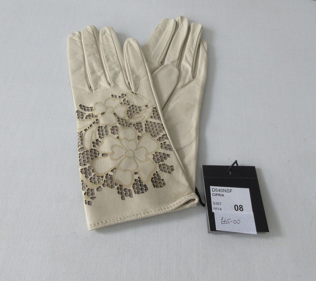 Tan Floral Cutout Gloves. Item Number D540NSF C1PRIA S357 0574. Tan Leather Gloves with floral cut-out design on top hand. 60g approximate weight. Made in Italy