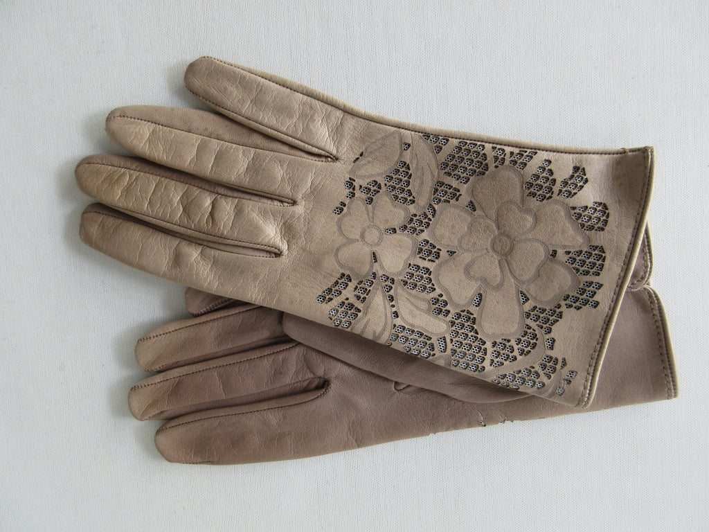 Taupe Floral Cutout Gloves. Item Number D54ONSF Tortora S359 0574. Taupe Leather Gloves with floral cut-out design on top hand. 60g approximate weight. Made in Italy