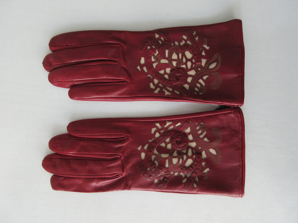 Gala Gloves Deep Red Gloves with Cutout Applique Design. Item Number D544CONSO26 RHUM 948.005. Featuring woven strips and floral pattern design. Made in Italy. 60g approximate weight