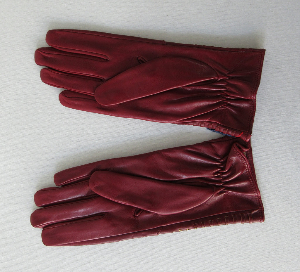 Gala Gloves Deep Red with Gold Studs Over Weave. Item Number D599NASE026 Rhum 948.001. Gold colour studs over weave design on top glove area. 60g approximate weight. Made in Italy