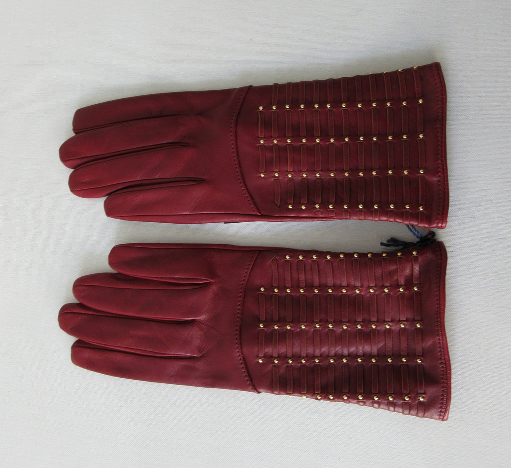 Gala Gloves Deep Red with Gold Studs Over Weave. Item Number D599NASE026 Rhum 948.001. Gold colour studs over weave design on top glove area. 60g approximate weight. Made in Italy