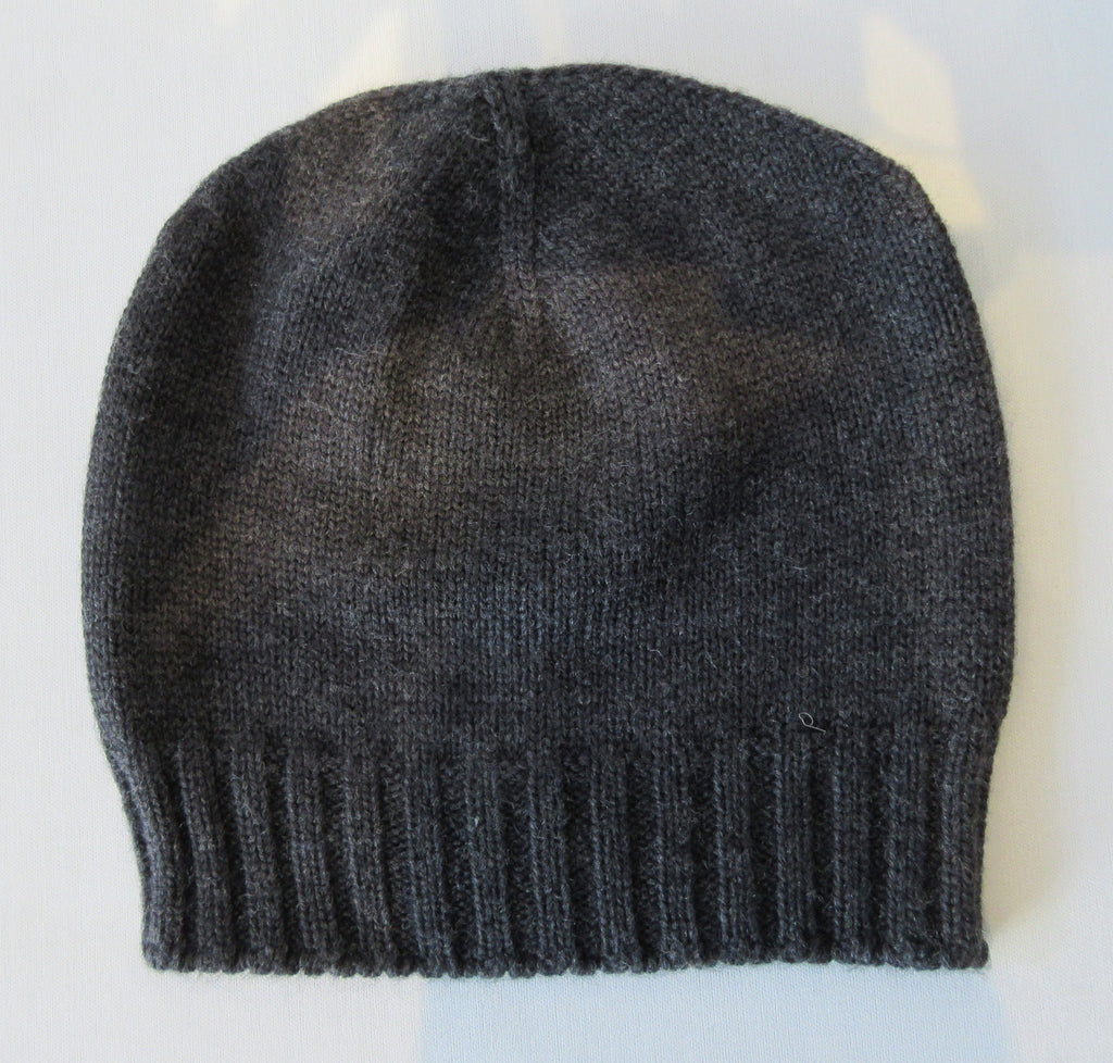  Charcoal Dark Crystal Hat. Knit Cap in Charcoal with mini Swarowski crystals on front. Crystals can be displayed full front or worn sideways. Article 90717 TG A/M. Width 22cm, Height 21cm. 50g approximate weight. 100% Wool Hand wash, Hang dry only. Made in Italy