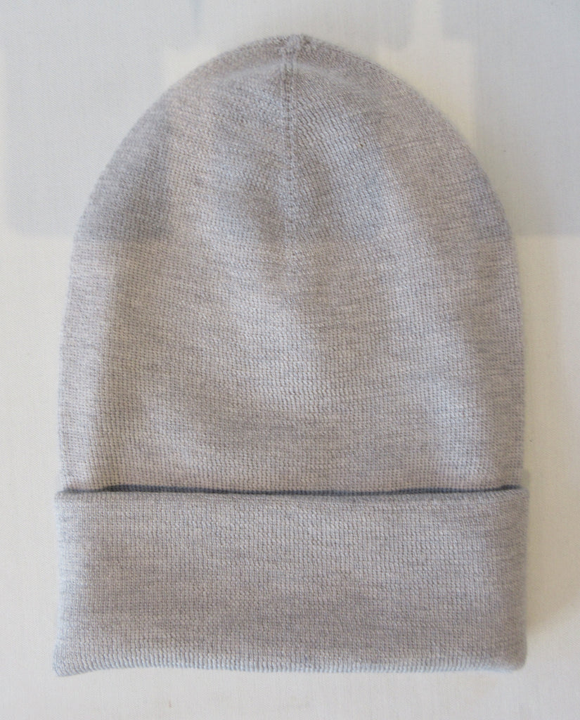 Regina Light Grey Alumino Silver Crystal Hat. Thicker lined light grey knit hat with silver Swarowski crystals. Crystals can be displayed full front or worn sideways. 8cm folding width. Article 90733 SUS8 TG A/M Alumino. Width 21cm. Height 24cm. 60g approximate weight. 100% Wool Hand wash, Hang dry only. Made in Italy