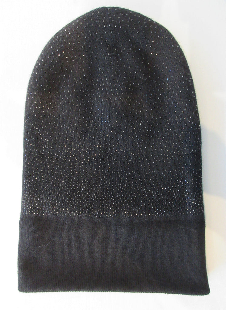 Regina Black Crystal Folding Hat. Knit Cap in Black with black shiny mini Swarowski crystals on front. Crystals can be displayed full front or worn sideways. 8cm width fold. Article 90733 SUS8M Nero. Width 21cm. Height 24cm. 55g approximate weight. 70% Wool, 30% Cashmere. Hand wash, Hang dry only. Made in Italy