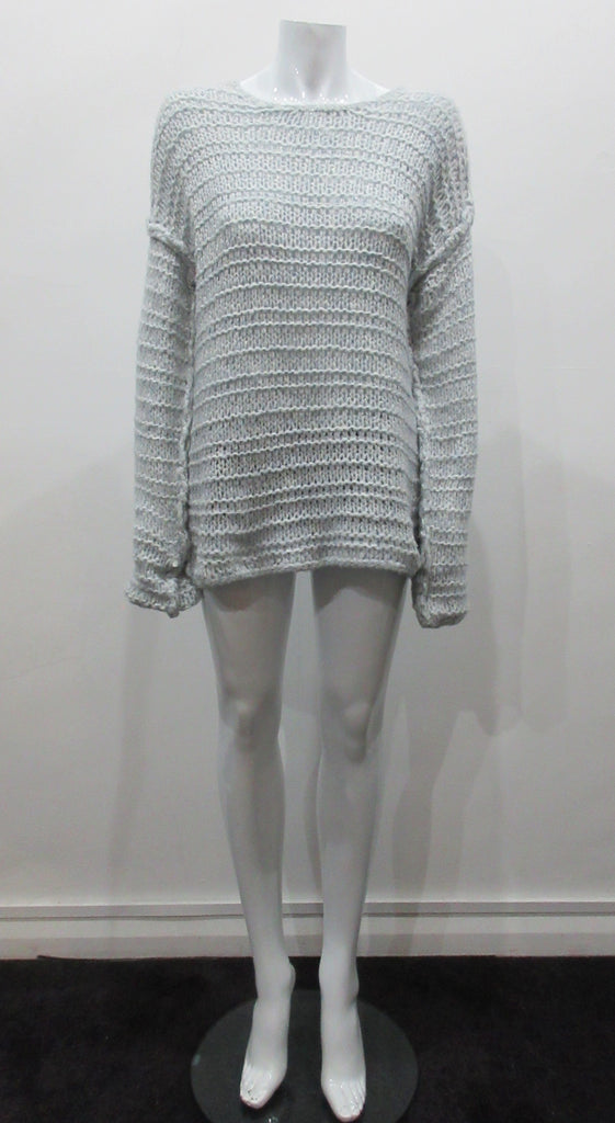 Chunky but light and airy knit jumper in pale ice blue colour. Hand knit style with super soft yarn. Size M