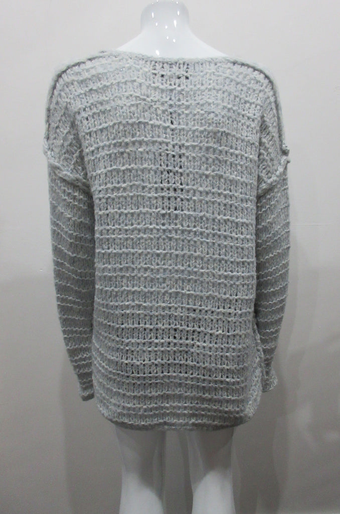 Chunky but light and airy knit jumper in pale ice blue colour. Hand knit style with super soft yarn. Size M