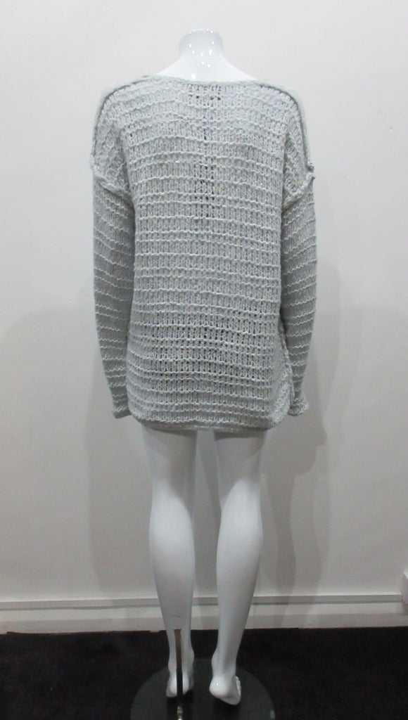 Chunky but light and airy knit jumper in pale ice blue colour. Hand knit style with super soft yarn. Size M