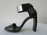 Vic Mate Metal Shin Heel. Product Number 1L5526D.L90L550101 Sandalo Alcazar 101 Black,  9.5cm leather heel. 100% Leather, Made in Italy