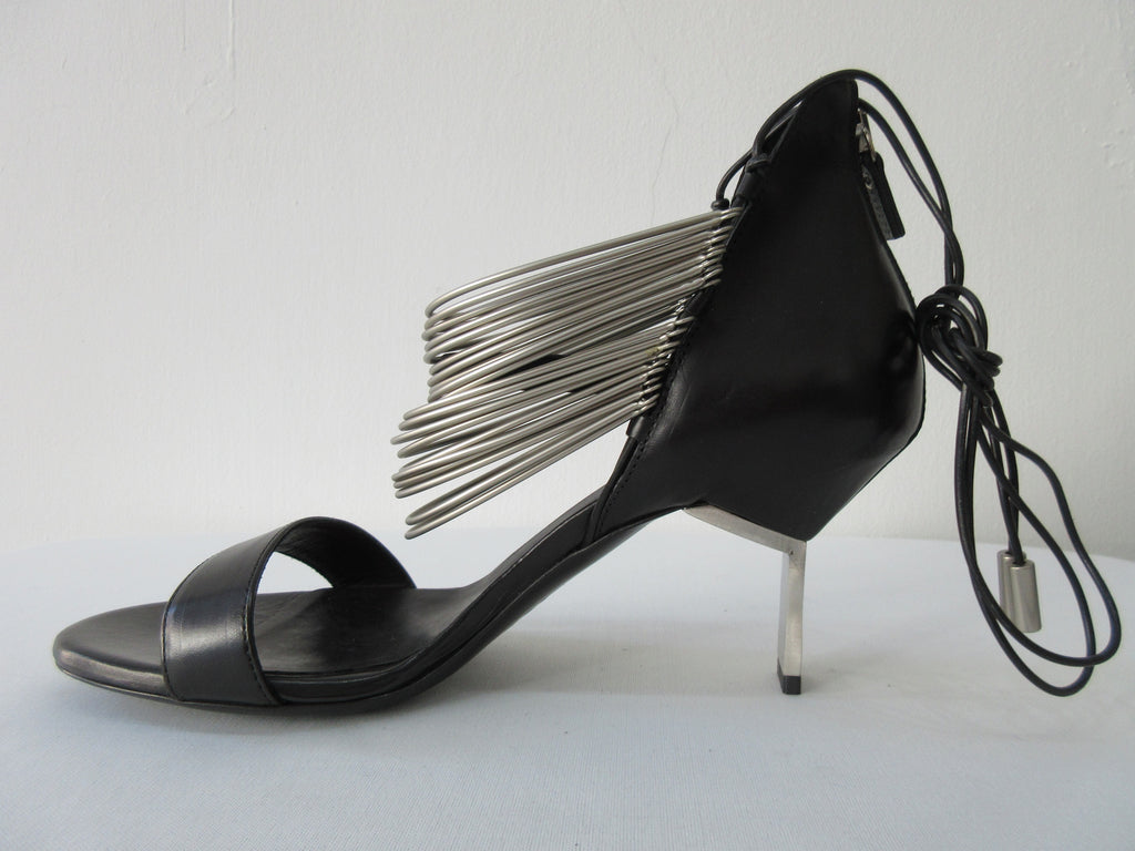 Vic Matie Black Curved Metal Heels, Product Number: Vic Matie 1N7002D.NB2CDZB323 Sandalo Modig/Acess 101/109, 4cm metal heel. 100% Leather with Stainless Steel rings and inside laces. Made in Italy