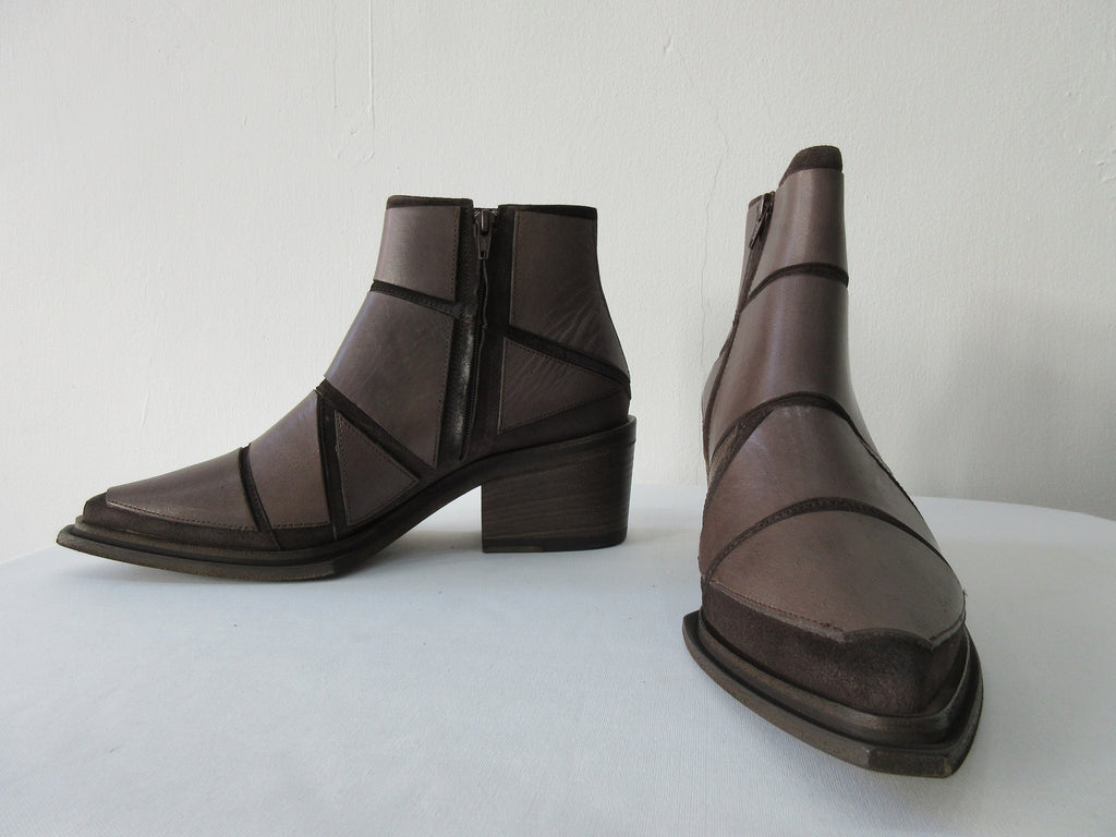 Vic Matie Brown Paneled Boot. Product Number: Vic Mate 1M6024D.M80 Combo 78 Tronch.HKS/Madden 125/351. Stitched panel leather panels in geometric design. Deep solid taupe colour. 100% Leather. Made in Italy