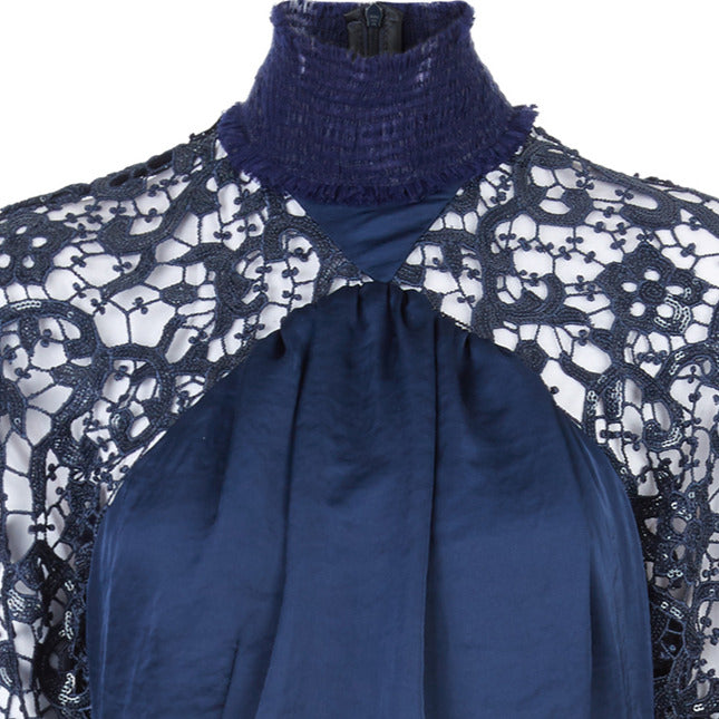 Elegant sequined lace dress in blue satin panel contrast and beige satin pleats. Ruched neckline with natural fraying effect. CB invisible zipper. 1.1kg approximage weight. 100% Polyester. Contrast: 81% Polyester, 14% Polyamide, 5% Elastine Dry Clean Only. Made in England